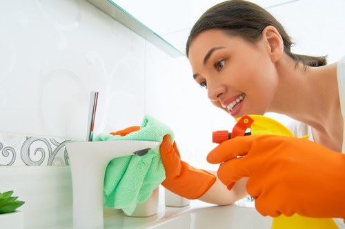 Bathroom deep cleaning focusing on tile, sinks, and fixtures